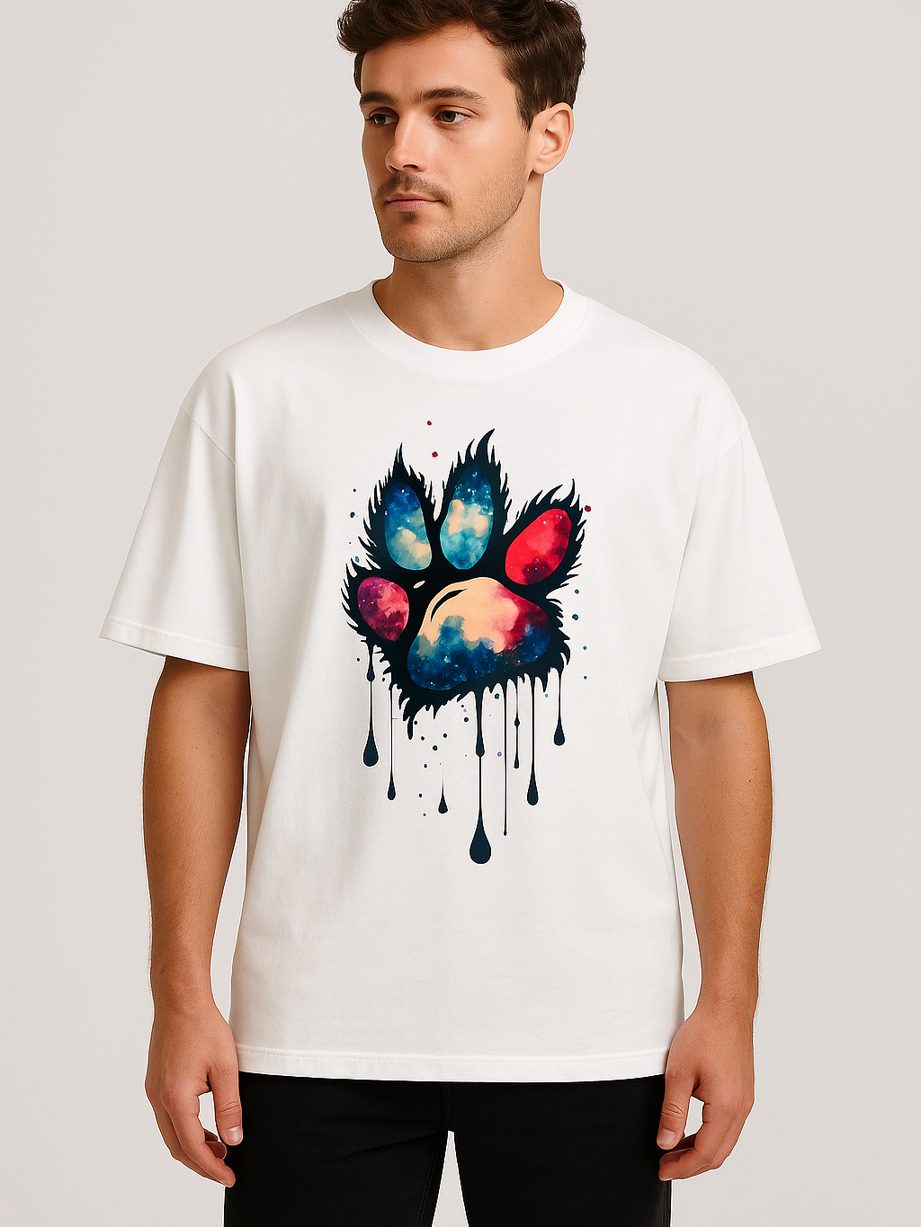Unisex oversized white t-shirt with vibrant multi-hue paw print graphic and relaxed fit