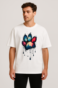 Unisex oversized white t-shirt with vibrant multi-hue paw print graphic and relaxed fit