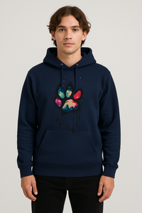 Man wearing navy unisex multi hue paw print hoodie with front pocket and drawstrings.